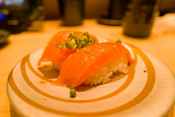 Salmon sushi in Osaka in Asia, Japan, Kansai, Osaka, in summer, on a sunny day.