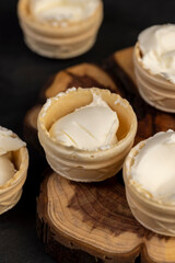 waffle cups with buttercream during dessert cooking