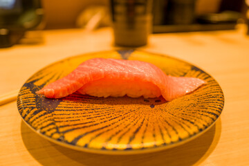 Salmon sushi in Osaka in Asia, Japan, Kansai, Osaka, in summer, on a sunny day.