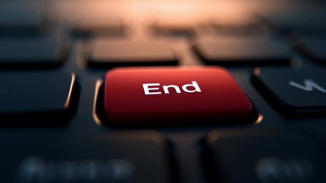 A close-up of a red "end" key located on a dark keyboard. The setting features soft lighting that highlights the key's color. The atmosphere suggests a sense of closure or finality.
