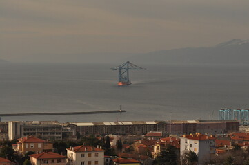 Rijeka, Croatia 17.02.2025. Ship transporting new crain's for Rijeka container terminal. Crain's were deported from China during 70 days of sailing to Rijeka harbour in Europe