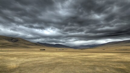 Obraz premium Majestic Mountain Range and Stormy Clouds Over Vast Plains