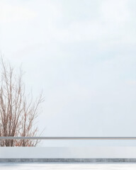 Minimalist landscape featuring bare tree and cloudy sky above tranquil surface