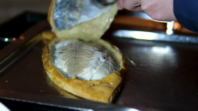 fish baked in dough, dorado Zander Fish Baked in Dough with Caviar and Cream Sauce. Restaurant food plate on white table. Delicious baked fish meal