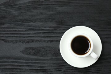 Cup of coffee on wooden background