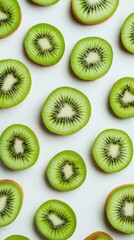 Fototapeta premium Bright green kiwi slices lie in a stunning pattern, each showcasing intricate seeds and vivid hues
