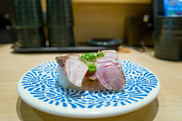 Sea bream sushi in Osaka in Asia, Japan, Kansai, Osaka, in summer, on a sunny day.