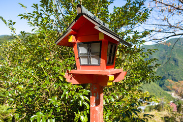 Lanterns on the path to Kumano-Nachi Taisha in Nachisan in Asia, Japan, Kansai, Nachisan, in summer, on a sunny day.