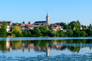 Dampierre-en-Burly view from the pond in Europe, France, Centre Val de Loire, Loiret, Dampierre en Burly, in summer, on a sunny day.