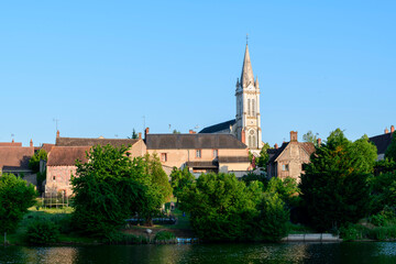 Fototapeta premium Dampierre-en-Burly view from the pond in Europe, France, Centre Val de Loire, Loiret, Dampierre en Burly, in summer, on a sunny day.