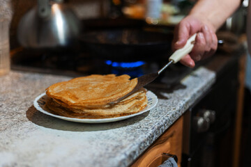 Baking delicious thin pancakes, cooking process. Delicious breakfast.