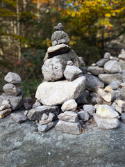 A carefully stacked stone cairn in a peaceful forest setting, symbolizing balance, mindfulness, and meditation. A perfect nature-inspired image for wellness, travel, and outdoor adventure themes