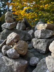 A carefully stacked stone cairn in a peaceful forest setting, symbolizing balance, mindfulness, and meditation. A perfect nature-inspired image for wellness, travel, and outdoor adventure themes