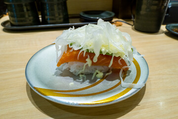 Salmon and avocado sushi in Osaka in Asia, Japan, Kansai, Osaka, in summer, on a sunny day.