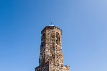 The tower of the cathedral in Castelsardo in Europe, Italy, Sardinia, Castelsardo, in summer, on a sunny day.