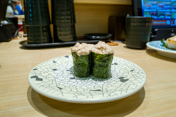 Tuna sushi cooked in Osaka in Asia, Japan, Kansai, Osaka, in summer, on a sunny day.