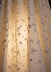 Spring Wedding Expo. Delicate bridal lace fabric illuminated in boutique setting, elegance