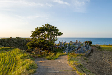 The cemetery by the sea in Asia, Japan, Kansai, Kinosaki, in summer, on a sunny day.