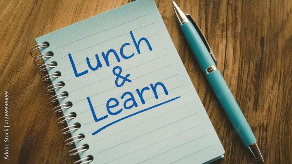 Aufkleber a notepad with lunch and learn is placed on wood