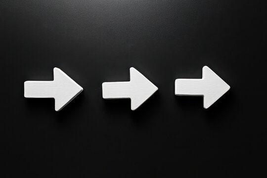 Simple white arrows on a dark surface guiding the way forward with bold clarity isolated on transparent background