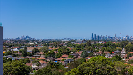 Fototapeta premium Aerial drone view above western Sydney of Rhodes and Wentworth point with views of buildings and Sydney Harbour NSW Australia 