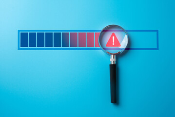Magnifying glass with warning sign on progress bar. Find problem stop or malfunction. Detecting...