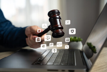 A man holding a judge's gavel symbolizes the services of a lawyer, the judicial system, and legal rights. Judicial authority, legal representation, justice. Protection of rights.
