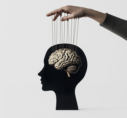 Concept of mind control with puppet strings manipulating human brain silhouette, representing influence, manipulation, psychology, propaganda, and behavioral science