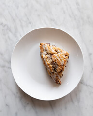 Blueberry scone on a plate fresh baked 