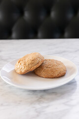 Sneaker-doodle cookies on a white plate, minimalist bakery