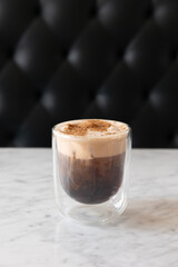 cup of coffee with cream and foam