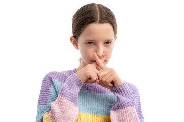 A young girl in a colorful sweater making an X gesture with her fingers against a white background.