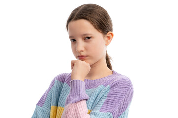 A young girl in a colorful sweater, looking serious with her hand on her chin against a white background.