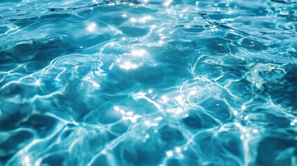 Obraz premium A close-up view of sparkling turquoise water, reflecting light and creating a serene atmosphere, perfect for relaxation and tranquility.