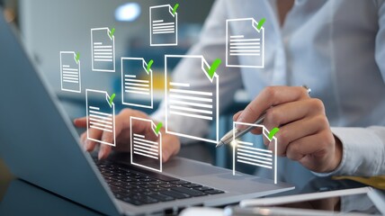 Woman working on a laptop with approved document icons