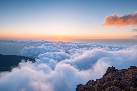Majestic sunrise over clouds reveals vibrant colors blending bea