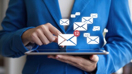 Woman manages email on tablet device with many notifications