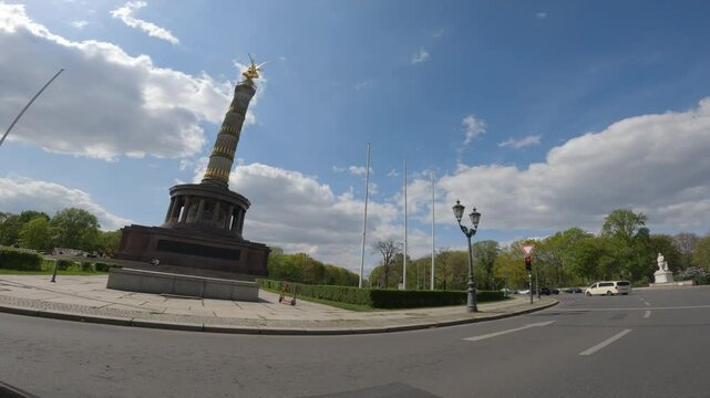 Driving on a roundabout with a view of the Victory Column in Berlin, Germany.