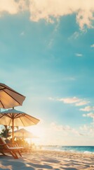 Relaxing beach scene with sun loungers and umbrellas under a blue sky