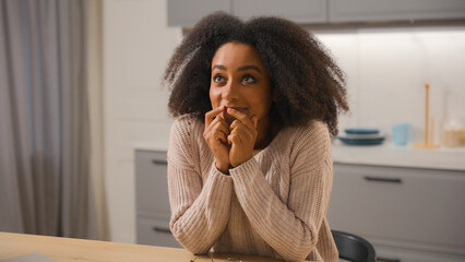 Dreaming ethnic woman African American girl dream wish imagine daydream female at home kitchen...