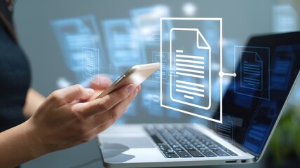 Woman accessing digital documents with her smartphone and laptop