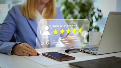 Satisfied customer leaving positive feedback 5 stars review online. Woman in office working at laptop computer rating a website experience using a virtual touch screen interface