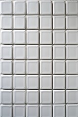 Fototapeta premium a textured wall surface. The style is realistic, capturing the intricate details of the wall's texture. The layout is a close-up view, focusing on the uneven and cracked surface.