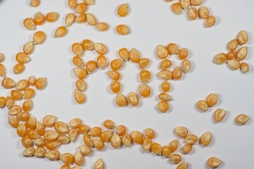 Popcorn kernels arranged to spell pop