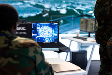IT expert monitors AI brain intelligence system to collect crucial real time data for a new defense...