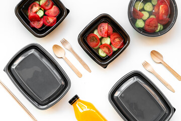 Tomatoes salad in plastic delivery tray, top view. Catering concept