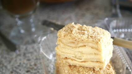 vanilla cake with cream on a wooden board