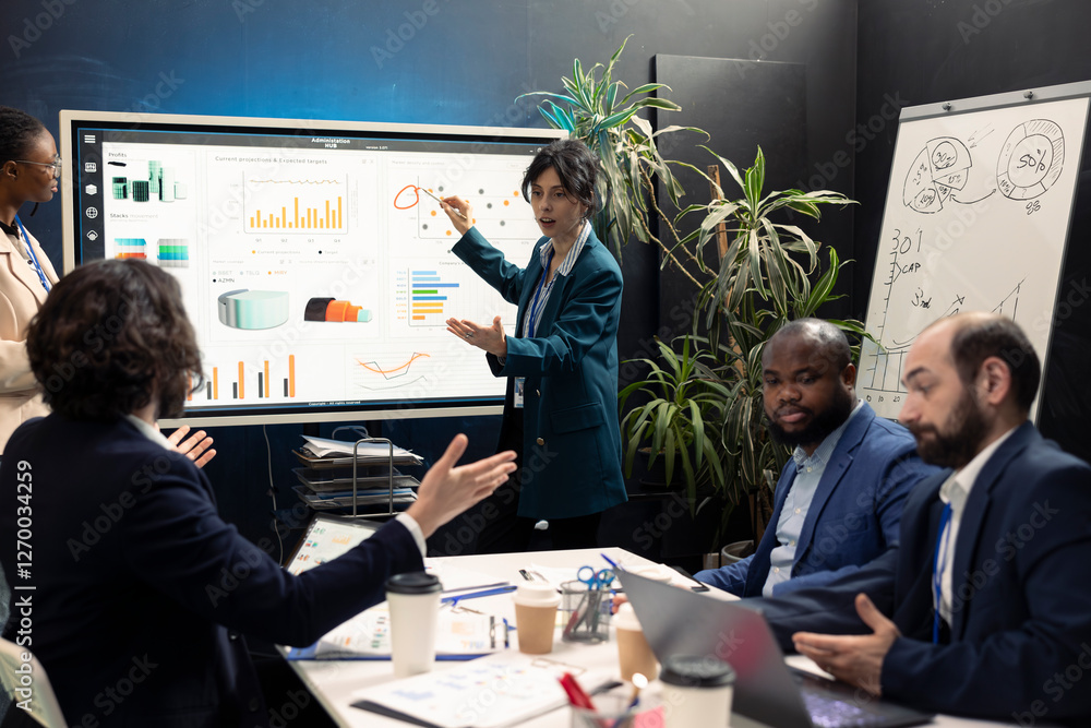 Poster business coworkers examining performance and efficiency metrics within the enterprise, presenting pr