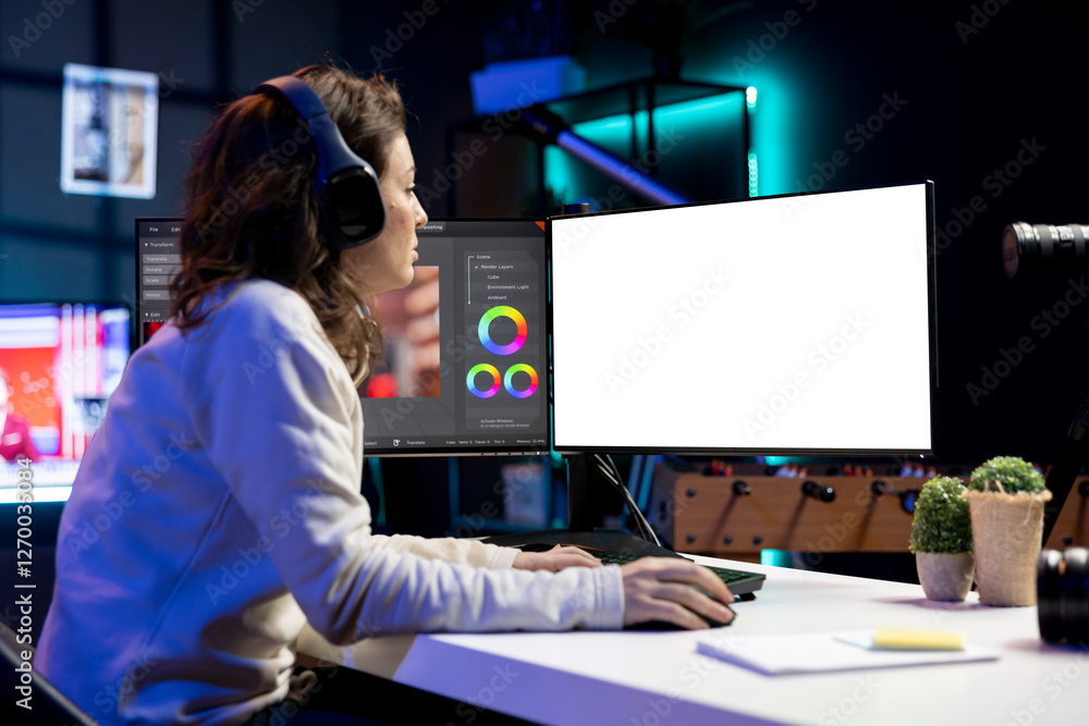 Poster video editor using editing software on isolated screen monitor to upgrade footage shot, commissioned