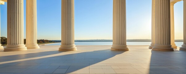 Fototapeta premium Dramatic view of Greek Revival columns framing an elegant entrance, illuminated by gentle morning light, showcasing architectural elegance and beauty.
